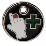 This circular metal charm depicts a green cross next to a hand with a blood drop coming out of a finger.