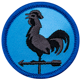A metal rooster sits on an arrow, forming a weather vane.