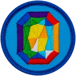A rainbow gemstone on a blue background.