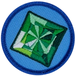 A square emerald on a blue background.