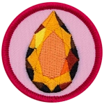 A sparkling topaz gemstone is in a teardrop shape on a circular background.