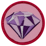 A shiny amethyst on a pink background.