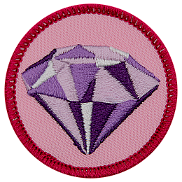 A shiny amethyst on a pink background.