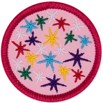 Multi-coloured stars on a pink background.