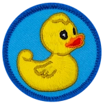 A yellow rubber duck stares vacantly off to the right of this round, merrow border patch.