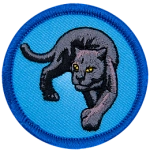 A black panther turns towards the viewer on a blue background.