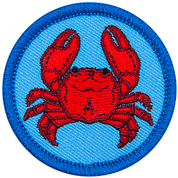 A crab is viewed from the top down on this circular crest.