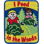 Two people peeing behind bushes with the words I Peed In The Woods above and below them.