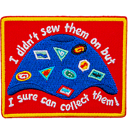 A camp blanket covered in patches, crests, and badges. The text reads, I didn't sew them on, but I sure can collect them!