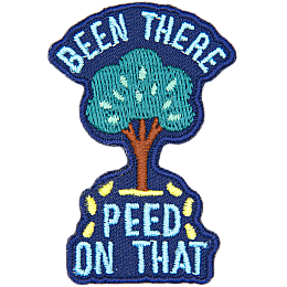 A tree sits between the words Been There Peed On That with little yellow droplets coming out of it.