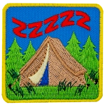 A brown tent in the woods with the letter Z above it a few times to represent sleep.