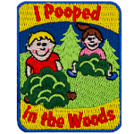 The words I Pooped In The Woods are above and below two figures in bushes.