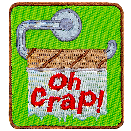 The words Oh Crap! are stitched on an empty toilet paper roll.