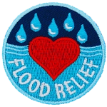 A heart in the middle of a body of water with rain above it. The words Flood Relief are across the bottom.