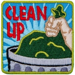 A hand places a garbage bag in a trash can. 