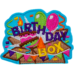 The words Birthday Box are over a smashed box with balloons coming out of it.