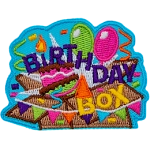 The words Birthday Box are over a smashed box with balloons coming out of it.