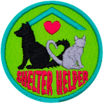 A cat and dog sit facing away from each other. Their tails curve together to make a heart. The words Shelter Helper are at the bottom.