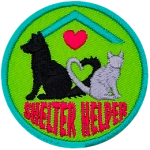 A cat and dog sit facing away from each other. Their tails curve together to make a heart. The words Shelter Helper are at the bottom.