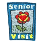 A red flower framed between the words Senior Visit.