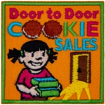 The words Door to Door Cookie Sales are above a little girl holding a box of cookies.