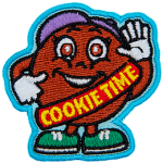 A large cookie dressed in a guide's uniform gives a thumbs up. The words Cookie time are stitched across her sash.