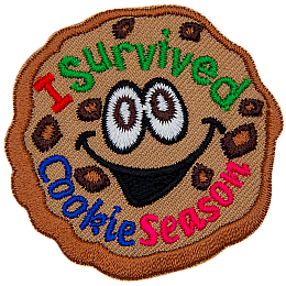 A chocolate chip cookie with wide eyes and a happy smile. The text I Survived Cookie Season is inside the cookie.