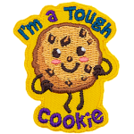 A chocolate chip cookie has a kawaii face. It proudly stands with its hands on its hips. Surrounding it are the words I'm a Tough Cookie.