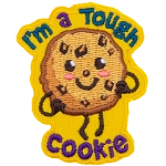 A chocolate chip cookie has a kawaii face. It proudly stands with its hands on its hips. Surrounding it are the words I'm a Tough Cookie.