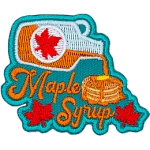 A bottle of syrup above the words Maple Syrup pours onto a pancake stack.