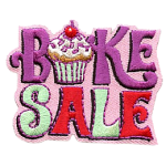 The words Bake Sale with a cupcake as the A.