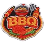 A grill filled with meat and the word BBQ in the middle.
