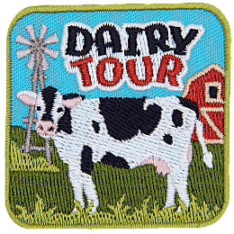 A black and white dairy cow faces the viewer underneath the words Dairy Tour.