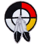 A healing circle with two feathers.