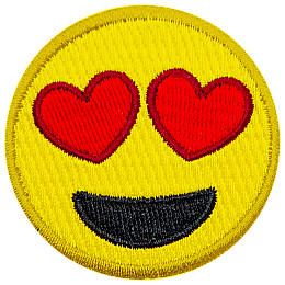 A yellow circle forms a smiley face with hearts for eyes and a big open-mouth smile.