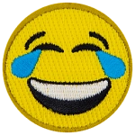 A yellow circle forms a smiley face with smiling eyes, tears, and a big laughing smile.