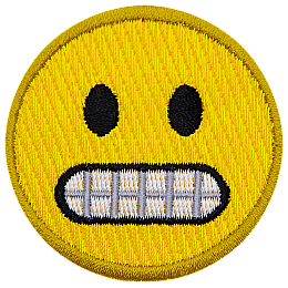 A yellow circle forms an emoji with wide black eyes and gritted teeth.