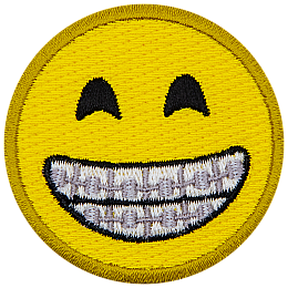 A yellow circle forms a smiley face with smiling eyes and a wide, toothy grin proudly displaying braces.