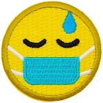 A round, yellow emoji face has a sweat drop above its eye and a medical mask over its mouth.