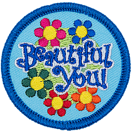 The words Beautiful You are in a patch of flowers.