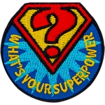A red diamond outline with a yellow center holds a red question mark inside. The diamond sits on a circle with the words What's Your Superpower?