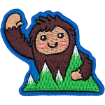 This happy bigfoot waves a warm welcome as they hold onto mountains.
