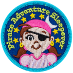 A young girl with an eyepatch and a bandana on. The words Pirate Adventure Sleepover are in an arch above her head.