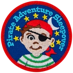 A young boy with an eyepatch and a red bandana. The words Pirate Adventure Sleepover are in an arc above his head.