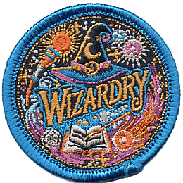 A wizards hat above the word Wizardry, surrounded by spells, a book and a magic wand.