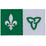 The left half of the flag has a white lily on a green background. The right half of the flag has a green trillium on a white background.