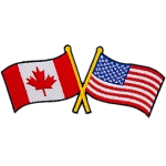 This badge displays the Canadian flag on the left and the United States flag on the right. The flag poles of each flag are crossed with each other.