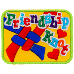 The words Friendship Knot are over the top of a knot made from red and blue string on a yellow background.