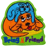 A tired cat rests on top of a tired dog with the text Bring A Friend embroidered underneath.