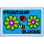 Two green flowers are on either side of a ladybug and bumblebee. The text around them reads Friendship Blooms.